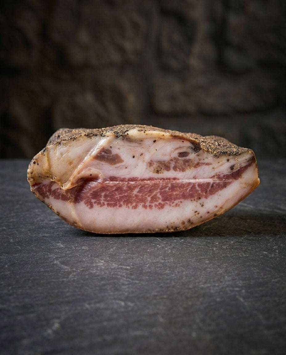 Guanciale matured pork cheek cured and dry-aged with black pepper in sealed 1kg pack from Italy