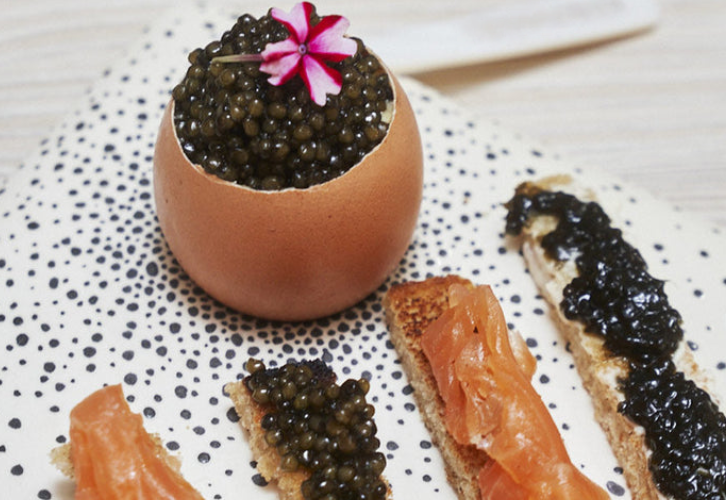 Scrambled eggs topped with Imperial Gold Caviar served with buttered toast soldiers and smoked salmon