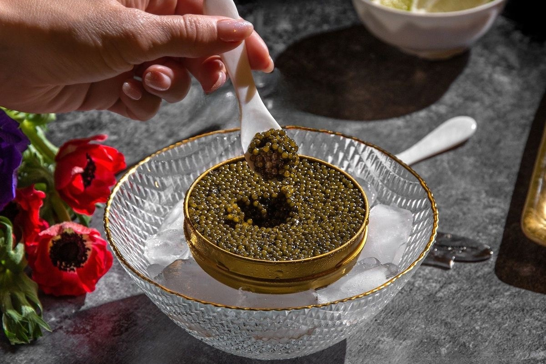 tin of premium sturgeon caviar with mother-of-pearl spoon for first time buying caviar guide