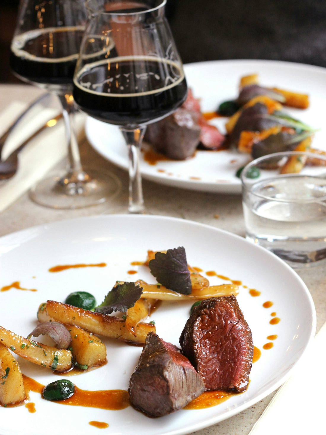Steak with vegetables and red wine; editorial image for a home tasting comparison
