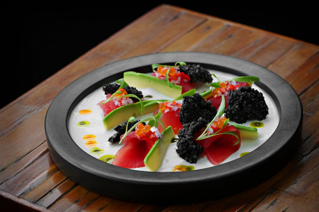Caviar scrambled eggs plated with golden Oscietra caviar on creamy soft scrambled eggs