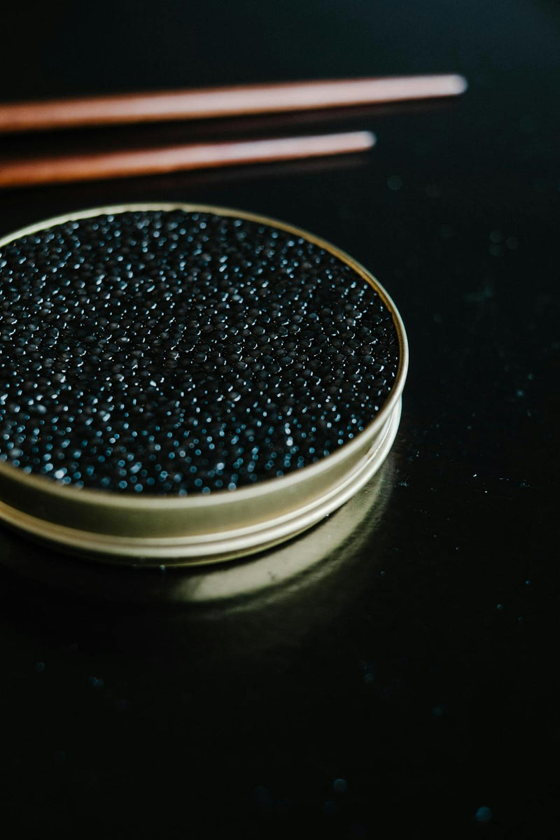 Close-up of Beluga and Oscietra caviar pearls side by side for luxury comparison