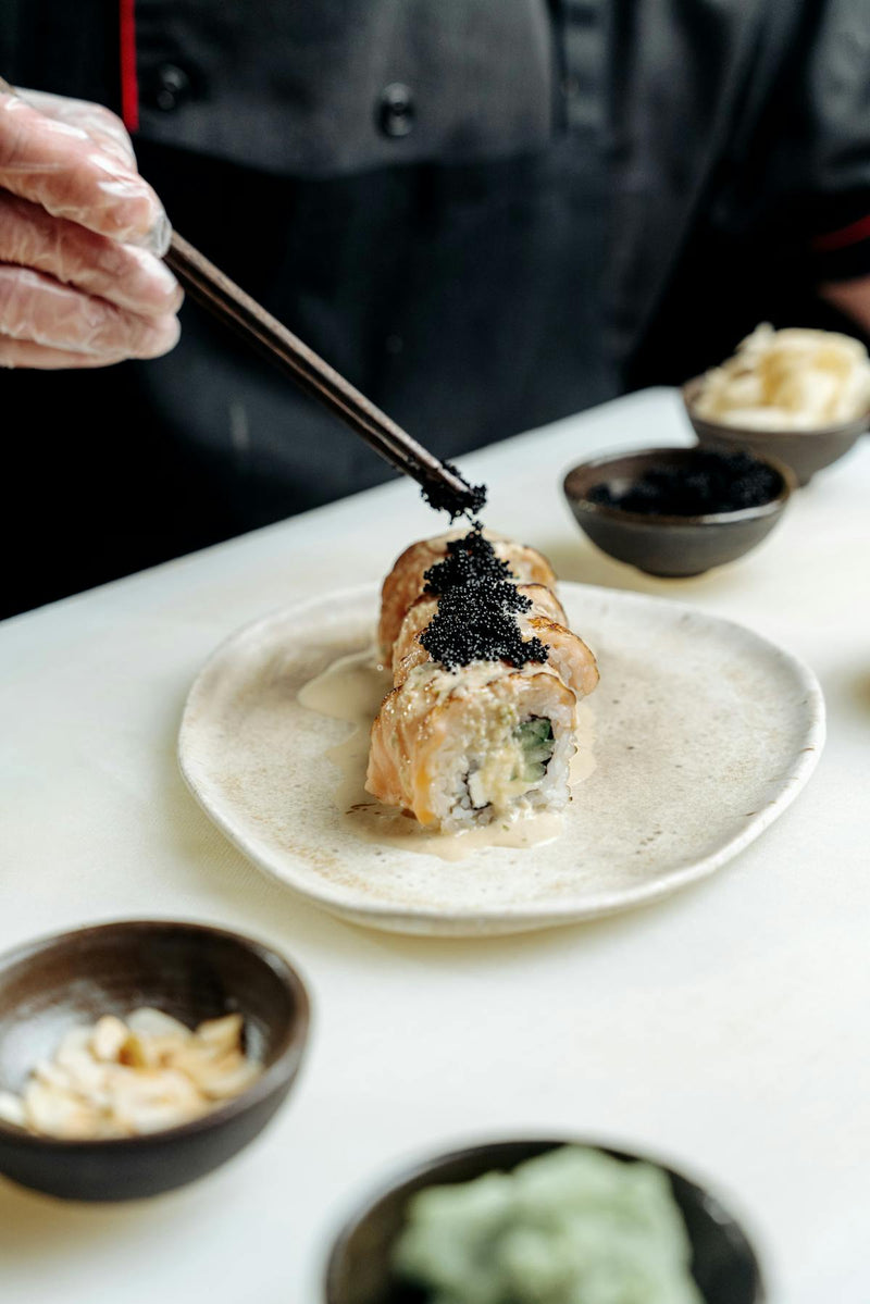 close-up of fresh salmon caviar ikura roe in glass bowl
