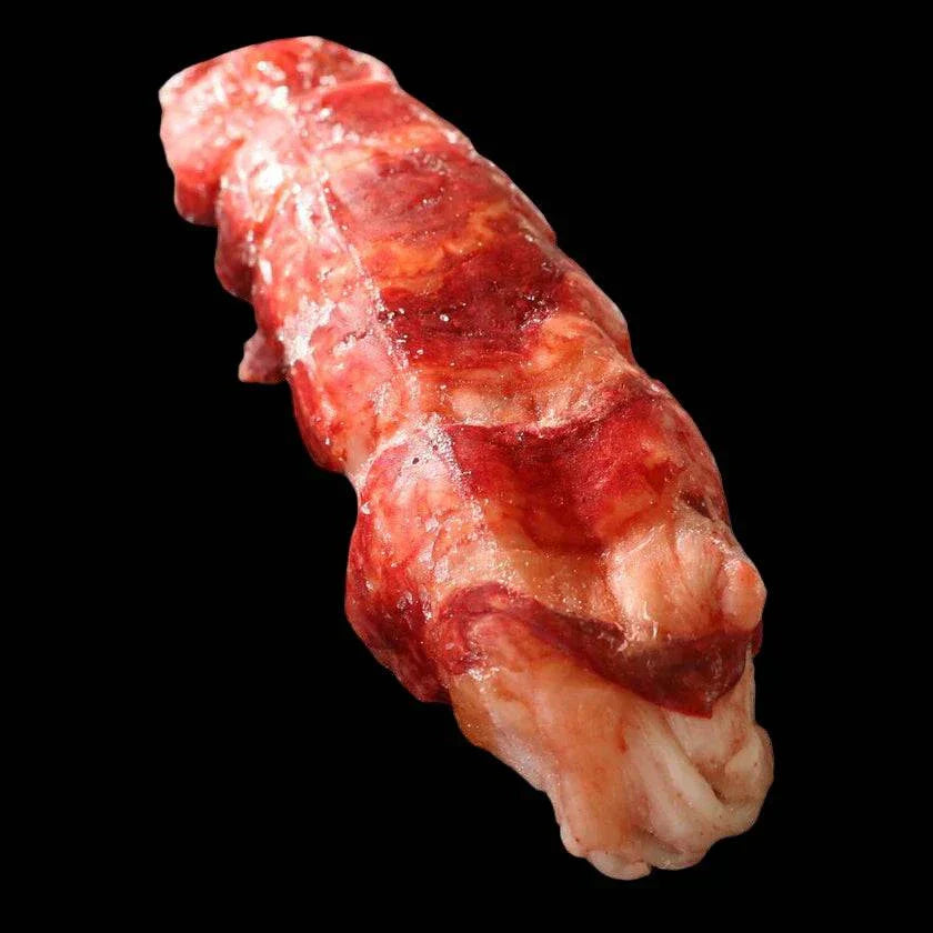 Rougie Blue Lobster tail and claw, raw, frozen, French cold-water lobster on a pale surface