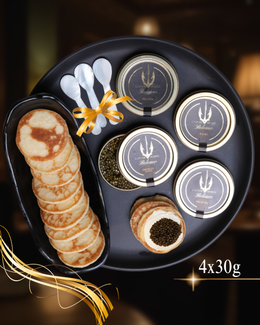 Beleaev Signature Tasting Set with four 30g premium caviar jars and mother of pearl spoons on a wooden tray