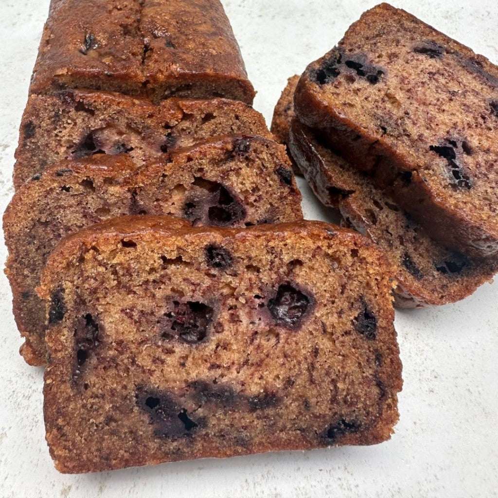 moist blueberry banana loaf cake slice with cinnamon and vanilla