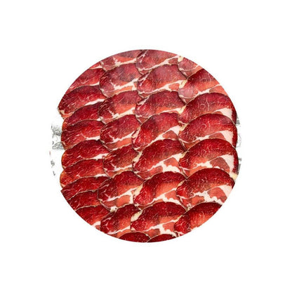 Cobble Lane Sliced Coppa showing thin red and white marbled British pork collar slices arranged in a circular pattern