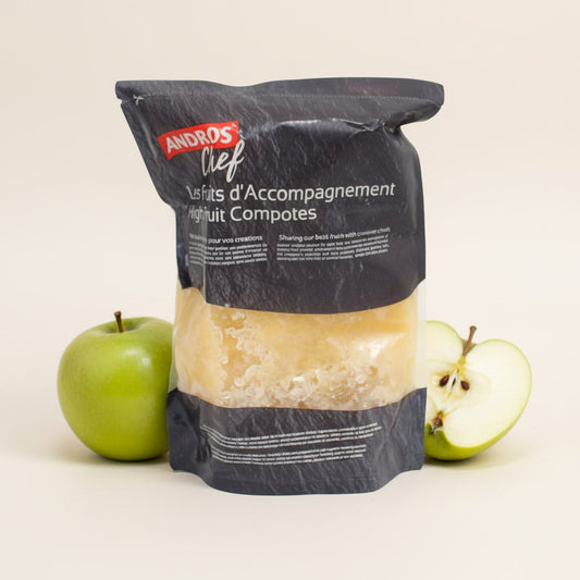 Compote Apple frozen puree in a clear pouch with black Andros Chef packaging, beside green apples