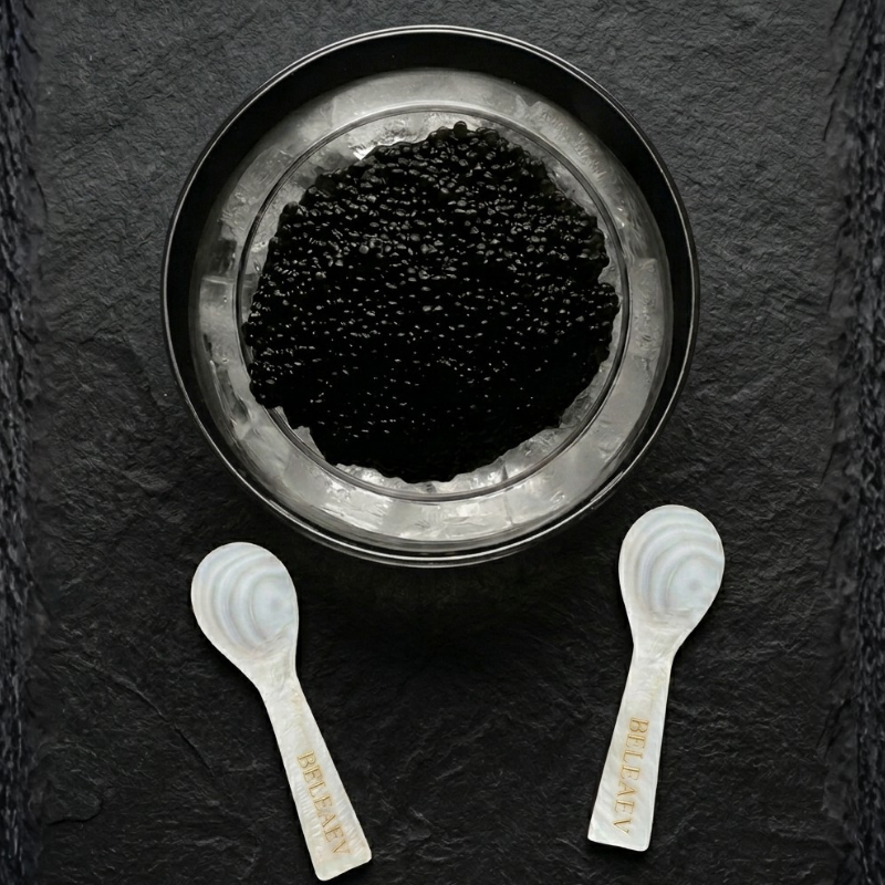 Glass caviar chiller set with hand-blown bowl and mother-of-pearl spoons