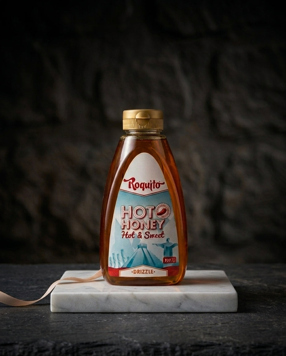 Jar of Hot Honey Roquito 720g with vibrant label on wooden surface