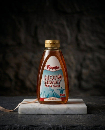 Jar of Hot Honey Roquito 720g with vibrant label on wooden surface