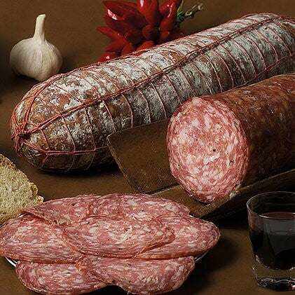 Italian grazing board with cured meats, cheese, truffle arancini, and flatbread