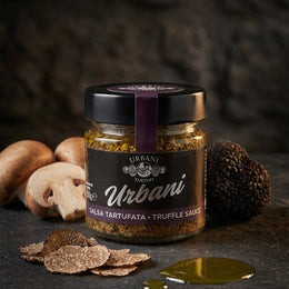 Jar of Tartufata Sauce 180gr with label on wooden surface