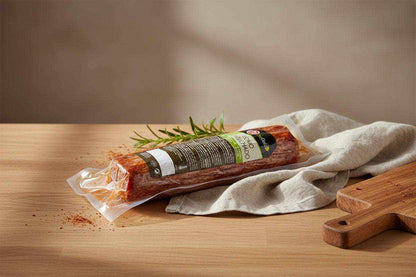 Vacuum-sealed 1kg Lomo Cured Pork Loin with firm texture and marbled appearance