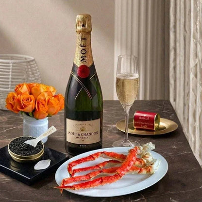 Luxury caviar hamper with Oscietra Royal caviar, king crab clusters, foie gras, blinis, and mother-of-pearl spoon