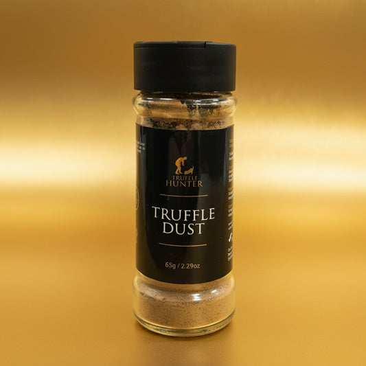 Bottle of Truffle Hunter truffle dust on a marble surface