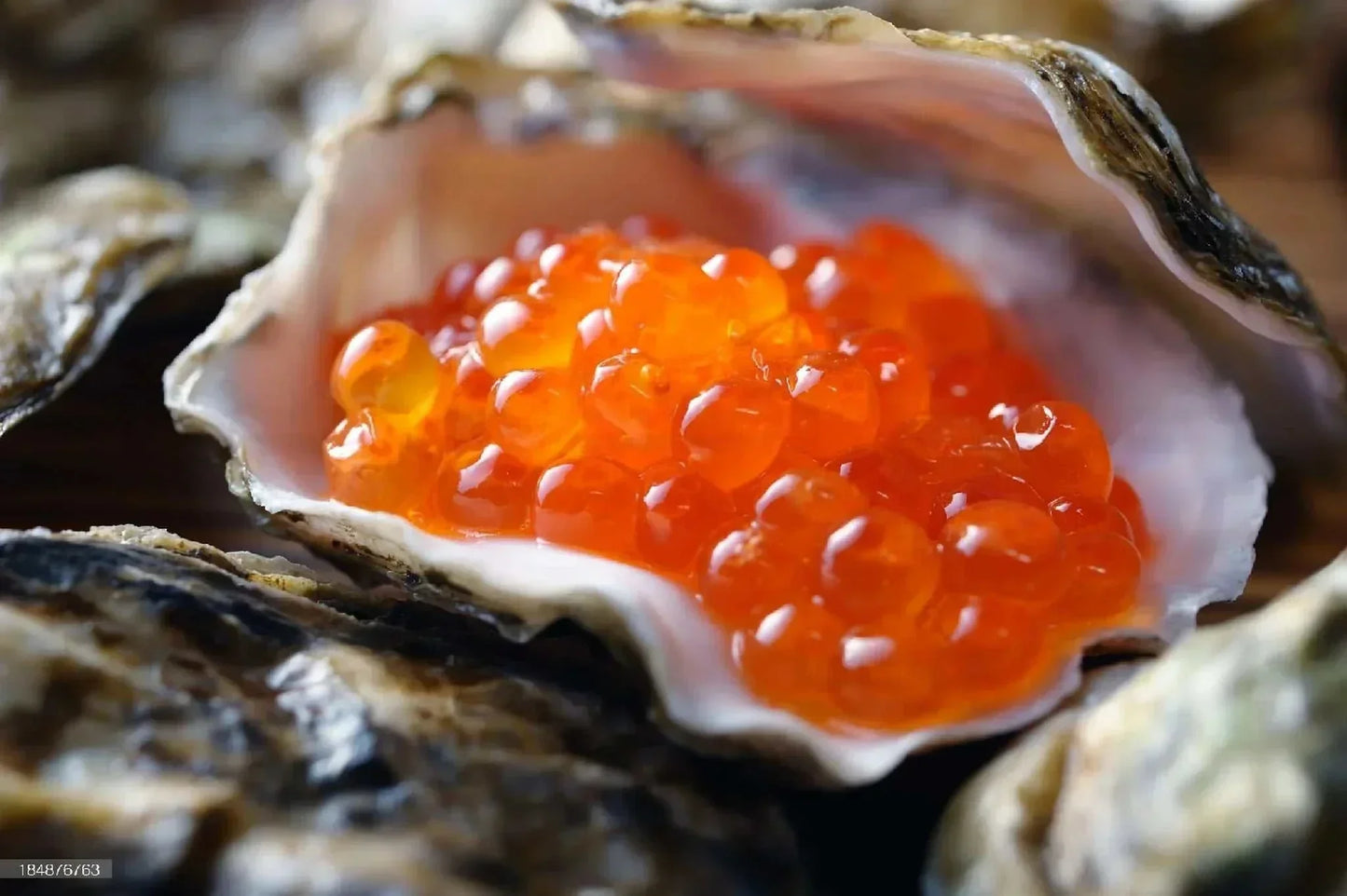 Close-up of wild salmon roe large orange pearls with juicy pop