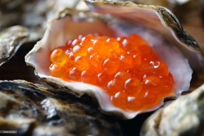Close-up of wild salmon roe large orange pearls with juicy pop