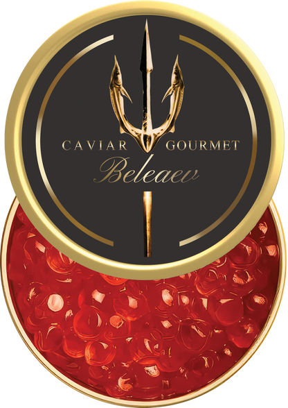 Wild salmon roe caviar bright orange eggs in glass jar on wooden board